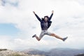 Bearded man, brutal caucasian hipster with moustache jump on mountain Royalty Free Stock Photo