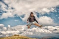 Bearded man, brutal caucasian hipster with moustache jump on mountain Royalty Free Stock Photo