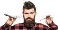 Bearded man, long beard, brutal, caucasian hipster with moustache. Mens haircut in barber shop. Barber scissors and Royalty Free Stock Photo