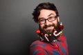 Bearded man with long lush beard and christmas tree toys