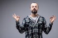 Bearded man meditating with a serene expression