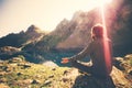 Bearded Man meditating yoga relaxing alone sitting lotus pose on stone Travel healthy Lifestyle Royalty Free Stock Photo