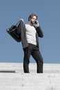 bearded man with phone and fashionable sport bag Royalty Free Stock Photo