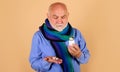 Bearded man with pills in hand. Male with bottle of medicine pill. Sick man taking tablet. Royalty Free Stock Photo