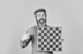 Bearded man play chess. Chess figures. Intellectual games. Grandmaster experienced player. Enjoy tournament. Game