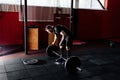 Bearded man putting weights on bar in gym. Preparing to workout. Royalty Free Stock Photo