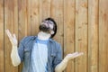 A bearded man raises his palms and head up and makes a moan. Emotions of despair and problems. Isolated on the background of an Royalty Free Stock Photo