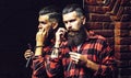 Bearded man with razor near mirror. Man with long beard. Handsome man hipster or guy with beard and moustache on serious Royalty Free Stock Photo