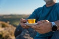Man relaxing alone on the top of mountain and drinking hot coffee. Travel Lifestyle concept The national park Peak Royalty Free Stock Photo