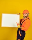 Bearded man repairman builder. Plan repair works. Visual outline. Repairman hold whiteboard copy space. Handsome