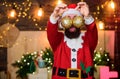 Bearded man Santa Claus decorating christmas tree with golden decorations. Most wonderful time of year. Decorations shop Royalty Free Stock Photo