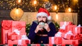 Bearded man santa hat. man drink hot milk. xmas present and gift. boxing day. hot tea in cold winter. winter holidays