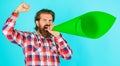 Bearded man scream in megaphone or loudspeaker. Announcing or spreading news. Protest. Own opinion. Royalty Free Stock Photo