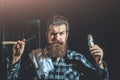 Bearded man shaves with razor Royalty Free Stock Photo