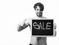 Bearded man, short beard. Caucasian young smiling macho with stylish hair, moustache with muscular torso holding Royalty Free Stock Photo