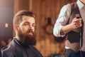 Bearded man sitting in the barbershop