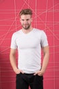 Bearded man smile in white tshirt and jeans. Bearded macho with beard and mustache on unshaven face