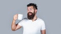 Bearded man smiling showing sign ok. Good morning, man tea, ok. Smiling hipster man with cup of fresh coffee, Happy man Royalty Free Stock Photo