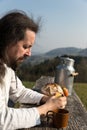 Bearded man is snacking in the nature Royalty Free Stock Photo