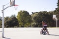 Bearded man in sports wheelchair playing basketball Royalty Free Stock Photo