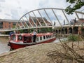 A bearded man stands on a narrowboat in Castlefield district in Machester, UK Royalty Free Stock Photo