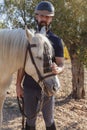 A bearded man stroking a white horse Royalty Free Stock Photo