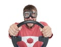 Bearded man in stylish goggles with steering wheel isolated on white background, car driver concept Royalty Free Stock Photo