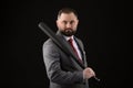 Bearded Man in suit and red tie with baseball bat