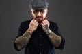 Bearded man with tattoo..brutal handsome man in hat Royalty Free Stock Photo