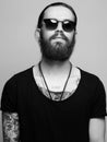 Bearded man with tattoo and sunglasses Royalty Free Stock Photo