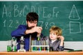 Bearded man teacher with little boy. biotechnoloy research concept. Back to school. Explaining biology to child. father