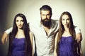Bearded man and two women Royalty Free Stock Photo