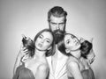 Bearded man and two women Royalty Free Stock Photo