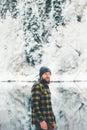 Bearded Man walking alone lake and forest winter landscape Royalty Free Stock Photo