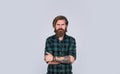 Bearded man wear checkered shirt. casual male fashion. concept of male beauty and brutality. man has long groomed Royalty Free Stock Photo