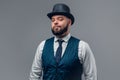 Bearded man wearing cylinder hat and waistcoat. Royalty Free Stock Photo