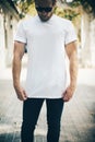 Bearded man wearing white blank t-shirt and blue Royalty Free Stock Photo