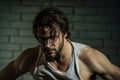 Bearded man with wet long hair in white singlet Royalty Free Stock Photo