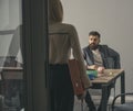 Bearded man and woman have business meeting. Boss talk to secretary in office. Businessman and businesswoman at work Royalty Free Stock Photo