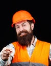 Bearded man worker with beard in building helmet or hard hat. Man builders, industry. Builder in hard hat, foreman or Royalty Free Stock Photo