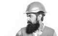 Bearded man worker with beard in building helmet or hard hat. Portrait architect builder, civil engineer working