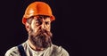 Bearded man worker with beard in building helmet or hard hat. Portrait builder, civil engineer working. Builder in hard