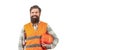 Bearded man worker in building helmet or hard hat. Portrait of a builder smiling. Worker in construction uniform. Man Royalty Free Stock Photo