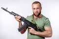 Man in black clothing with sniper rifle aiming  on white Royalty Free Stock Photo