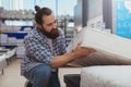 Bearded mature man shopping at furniture store Royalty Free Stock Photo