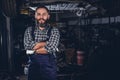 Bearded mechanical male in a garage.