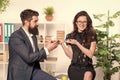 Bearded man and attractive woman. Man and woman conversation coffee time. Office rumors. Office coffee. Couple coworkers Royalty Free Stock Photo