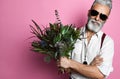 Bearded middle-aged man with flowers. Royalty Free Stock Photo
