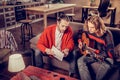 Bearded music tutor showing his student musical notes