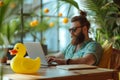 A Bearded Office Worker Enjoys Summer Vibes With A Laptop And A Rubber Duck Standard